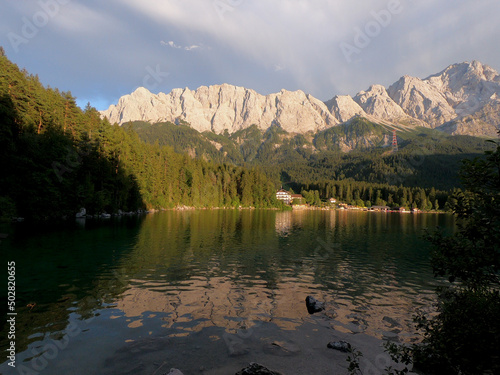 Beautiful nature of Germany's Eibsee, turquoise water lake with stunning view on the Alps