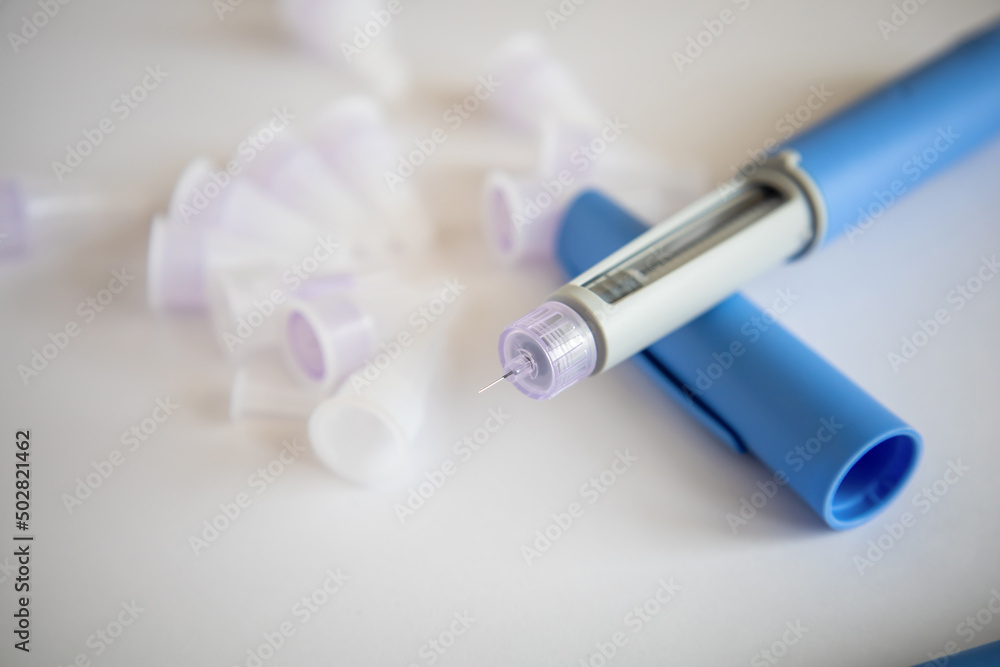 Insulin injection pen or insulin cartridge pen for diabetics. Medical equipment for diabetes parients. High quality photo Insulin injection pen or insulin cartridge pen for diabetics. Medical equipment for diabetes parients. High quality photo