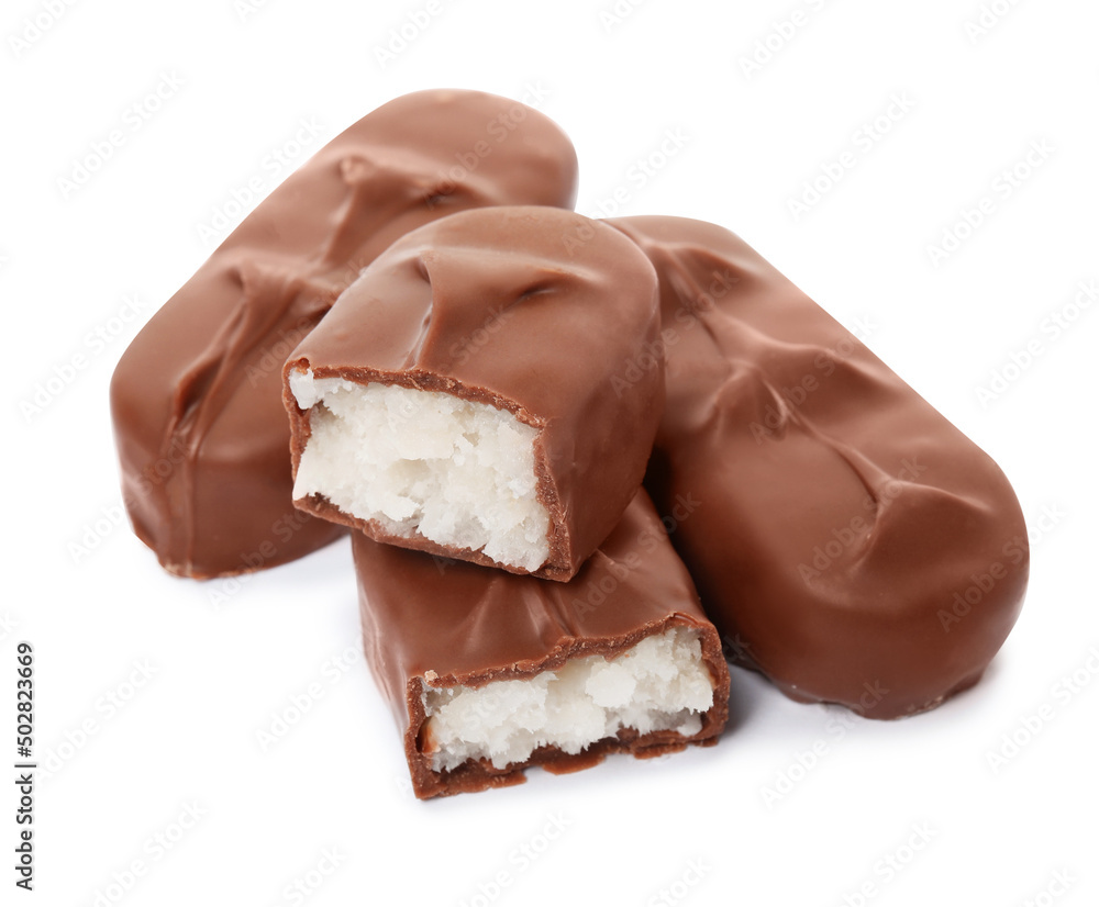 Delicious milk chocolate candy bars with coconut filling on white background Delicious milk chocolate candy bars with coconut filling on white background