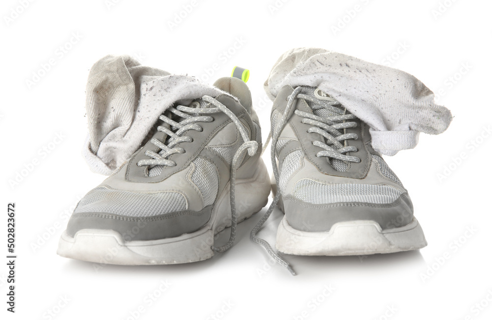 Sneakers with dirty socks on white background Sneakers with dirty socks on white background