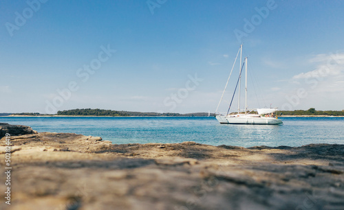 Sailboat in the bay at anchor, copy space