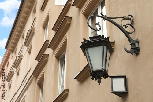 Vintage street lamp on wall of building