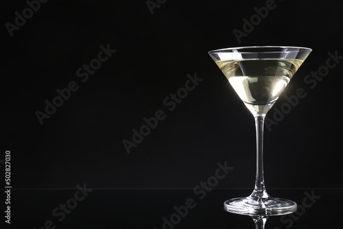 Martini cocktail on dark background. Space for text