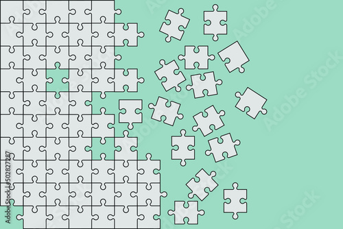 partially assembled jigsaw puzzle with scattered pieces