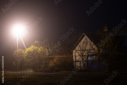 Brick house and lantern in the fog, Russia
