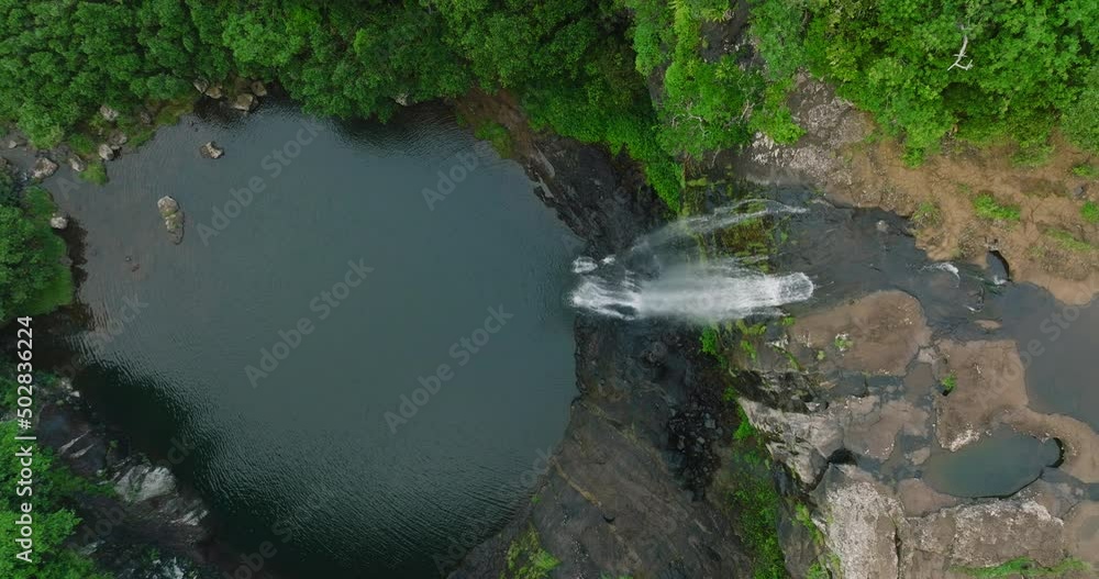 Aerial View. Flight over tropical river stream, forest and mountain in the rainy season at National Park. Mauritius Aerial View. Flight over tropical river stream, forest and mountain in the rainy season at National Park. Mauritius