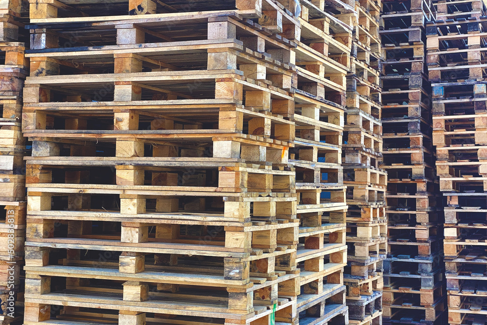 Big bunch of used wooden cargo pallets