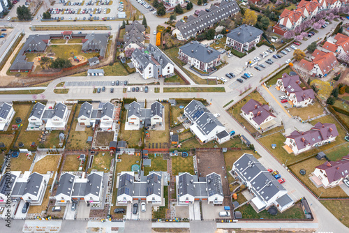 Slika na platnu Aerial view of a densely built-up residential area with detached houses located in new private neighborhoods