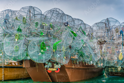 A multitude of lobster cages on Arabian dhows at Abu Dhabi's fishing port Al Mina 