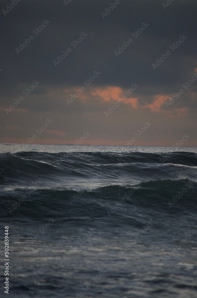 waves in the ocean at sunset