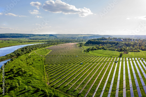 Ecology solar power station panels in the fields green energy at sunset landscape electrical innovation nature environment