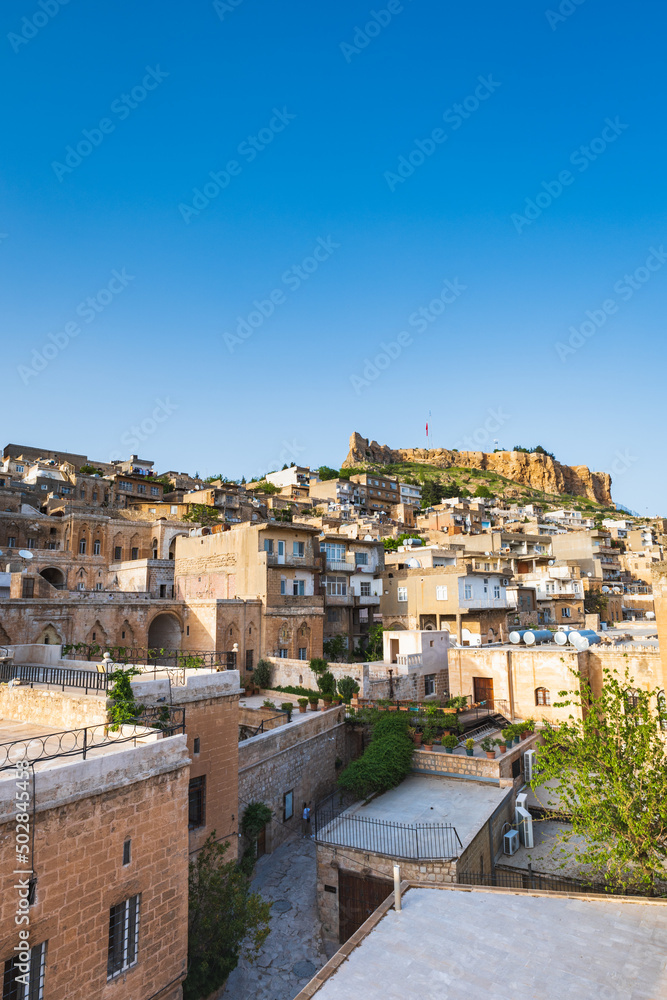 Mardin old town view with Mardin castle at the top,  cityscape of Mardin in Turkey