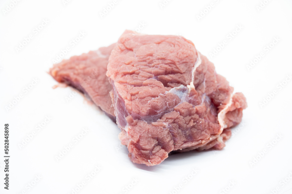 Fresh raw beef steak isolated on white background. Large piece of buffalo meat filet closeup Fresh raw beef steak isolated on white background. Large piece of buffalo meat filet closeup