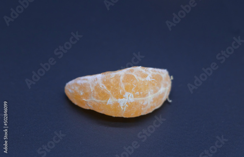 single pieces of Tangerine or kamala on black background
