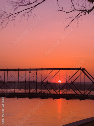 Sunset with bridge and river.