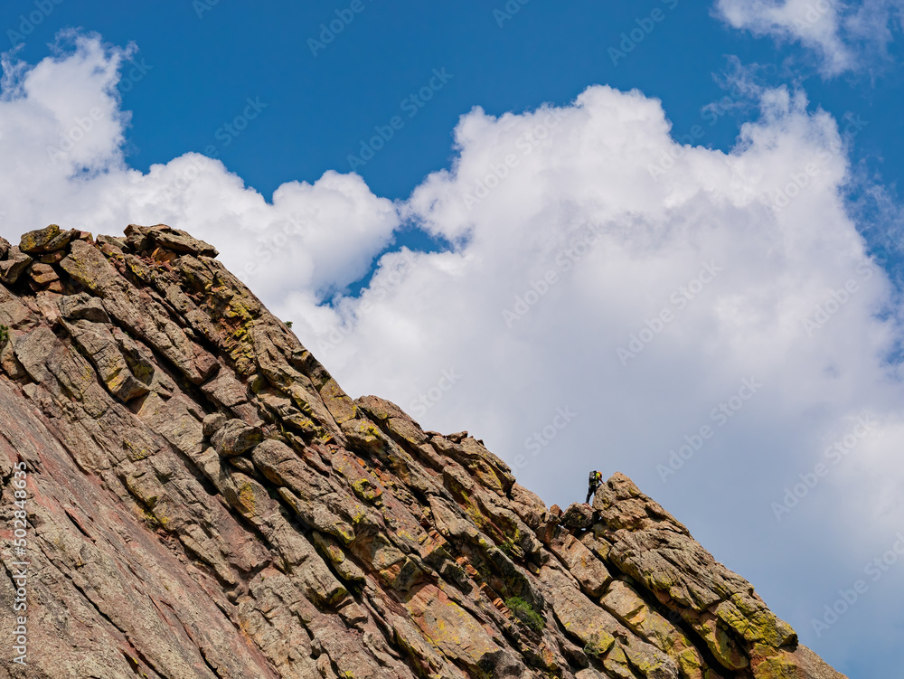 People playing rock climbing on the Flatirons People playing rock climbing on the Flatirons