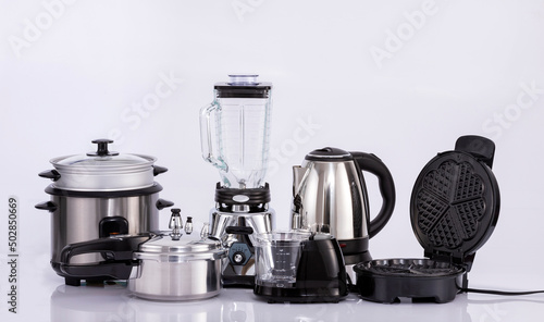 Modern small kitchen appliances on neutral background
