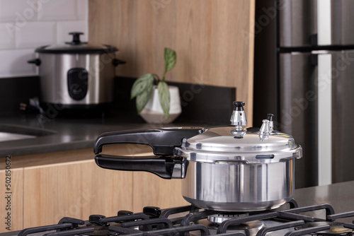 Small silver pressure cooker - Kitchen setting photo