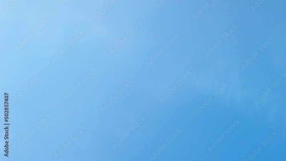 time lapse of clouds formation passing fast and disappear in blue clear sky time lapse of clouds formation passing fast and disappear in blue clear sky