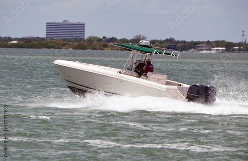 Open sport fishing boat on the Florida `intra-Coastal Waterway