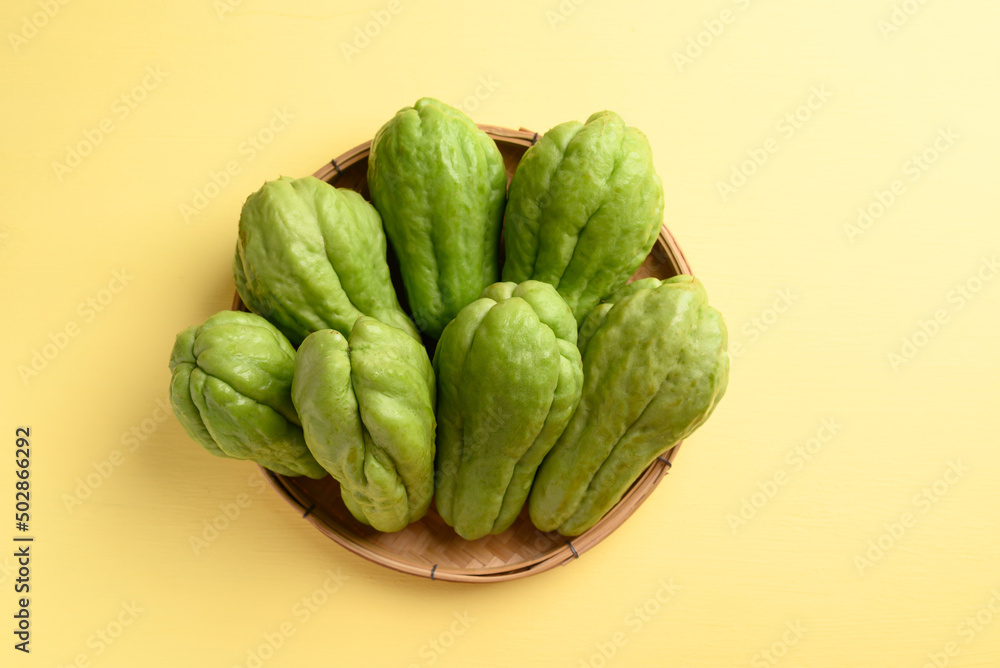 Fototapeta premium Chayote squash fruit on yellow, Organic vegetables from local market
