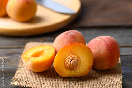 Asian peach fruit on wooden background