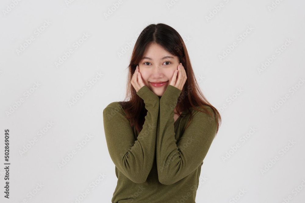 Image of happy young girl standing and Looking camera pointing isolated over white background. Image of happy young girl standing and Looking camera pointing isolated over white background.