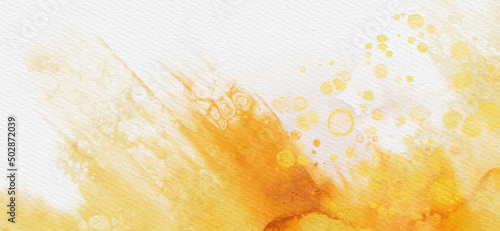 Abstract gold and yellow watercolor paint background.