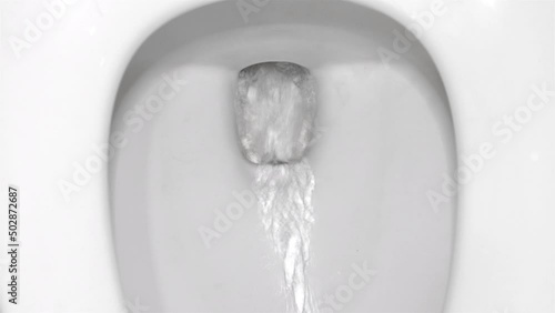 The flushing process in the toilet bowl, top view photo