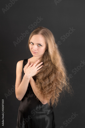 studio portrait of a woman with long hair