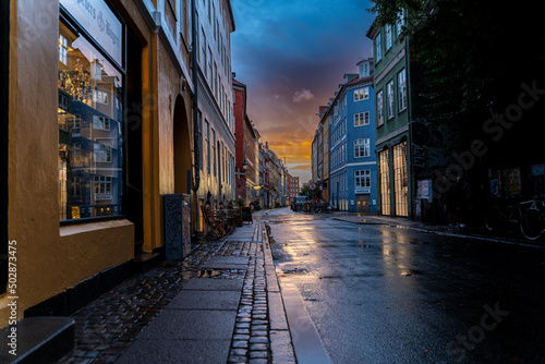 Beautiful sunset on a european narrow street in Copenhagen, Denmark  © Gian