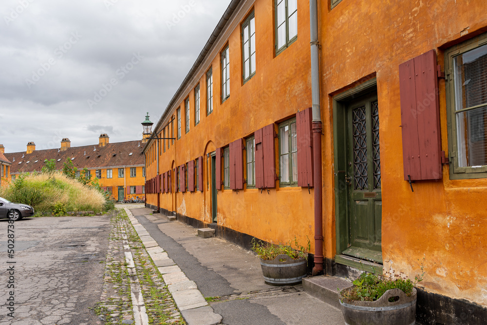 Fototapeta premium Beautiful view of the Old orange houses in the famous Nyboder district. Copenhagen. Denmark