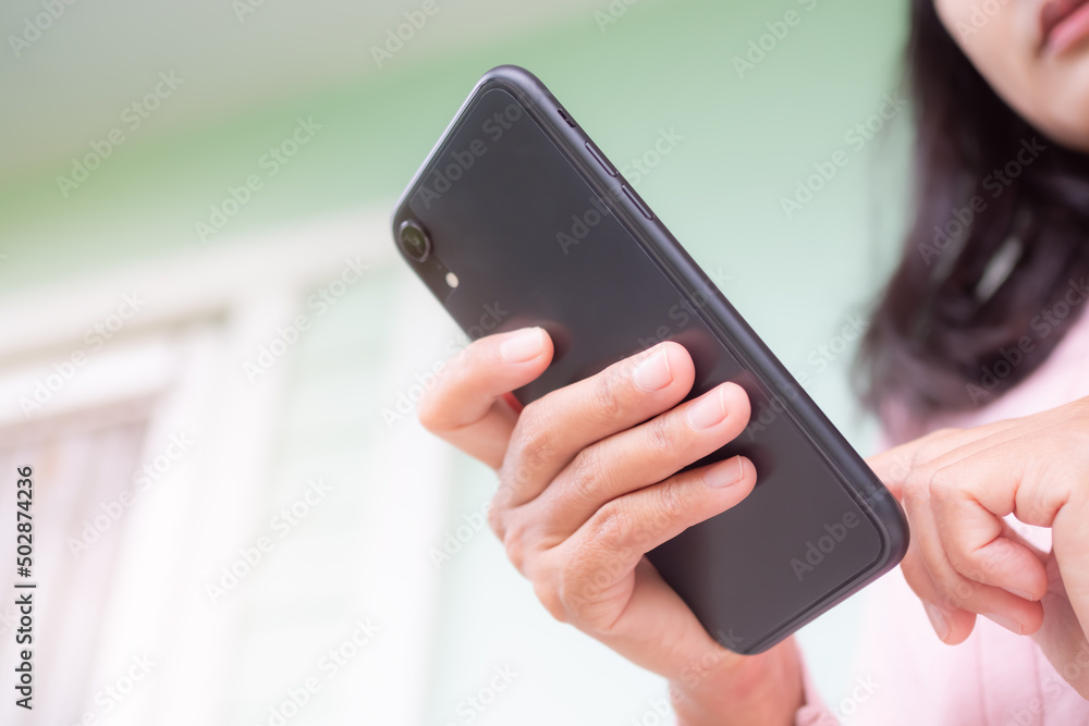 Woman use mobile close up. finger touch screen on smartphone for send message. she Video call to friend.Technology internet communication for lifestyles. for shopping online, blocker concept. Woman use mobile close up. finger touch screen on smartphone for send message. she Video call to friend.Technology internet communication for lifestyles. for shopping online, blocker concept.
