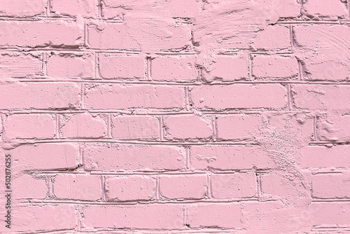 Pink brick wall background. Painted pink colour brick wall. Abstract wall background. Painted brick texture. Trendy colour.