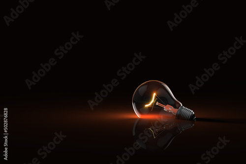 empty edison bulb no light bright red dim silhouette on black dark mysterious background Fototapet