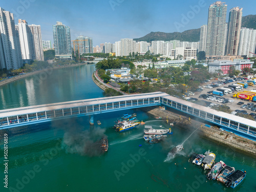 Top view of Hong Kong residential district and fire accident on boat