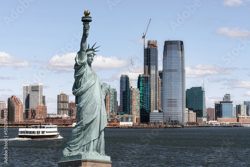 The Statue of Liberty over the Scene of New york cityscape river side which location is lower manhattan,Architecture and building with tourist concept
