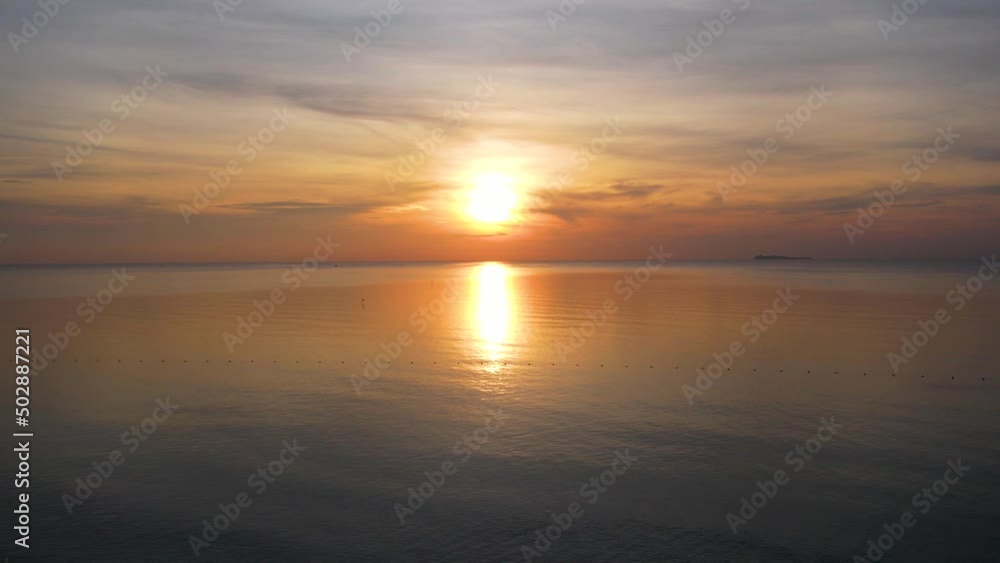 Wide angle aerial video of water and sea and waves in the Andaman Sea in the evening. island sunset Beautiful and amazing atmosphere with paradise island. Wide angle aerial video of water and sea and waves in the Andaman Sea in the evening. island sunset Beautiful and amazing atmosphere with paradise island.