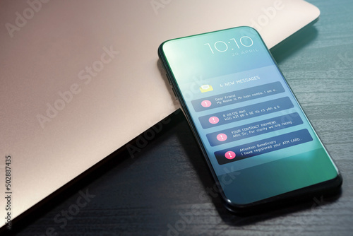 New emails marked as spam. Reminder and notification on the mobile phone screen. Scam, fraud e-mails, malware spreading virus concept. Irrelevant unsolicited malicious electronic mail