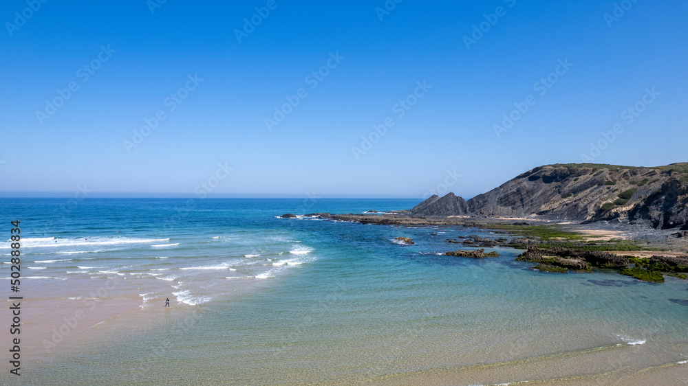 Beautiful beach in portugal, travel concept. Blue ocean and seashore