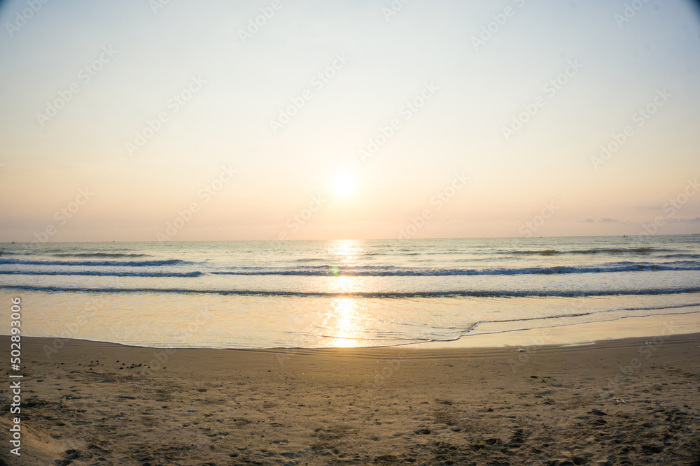 Wave beach sunset with light nature vacation background