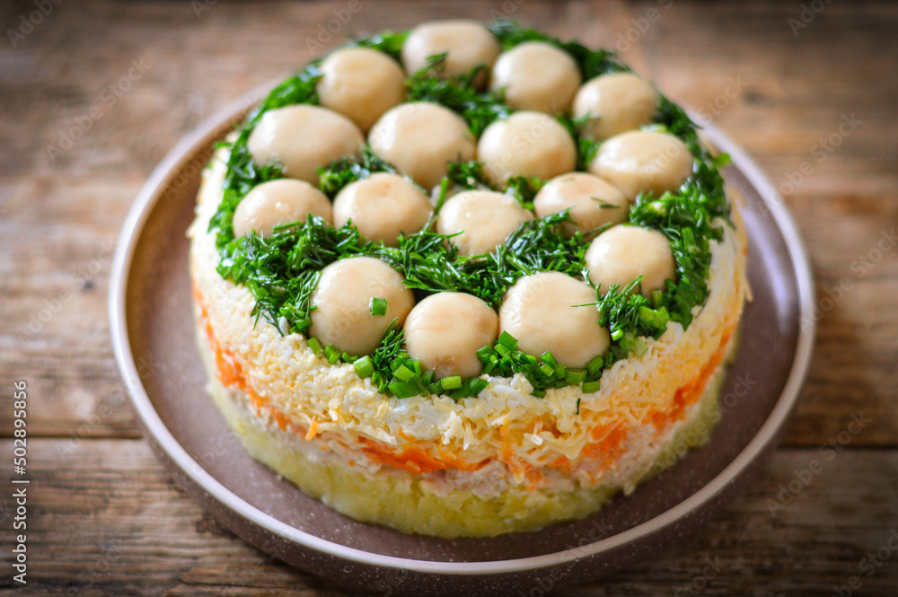 Layered salad with whole champignon mushrooms Layered salad with whole champignon mushrooms