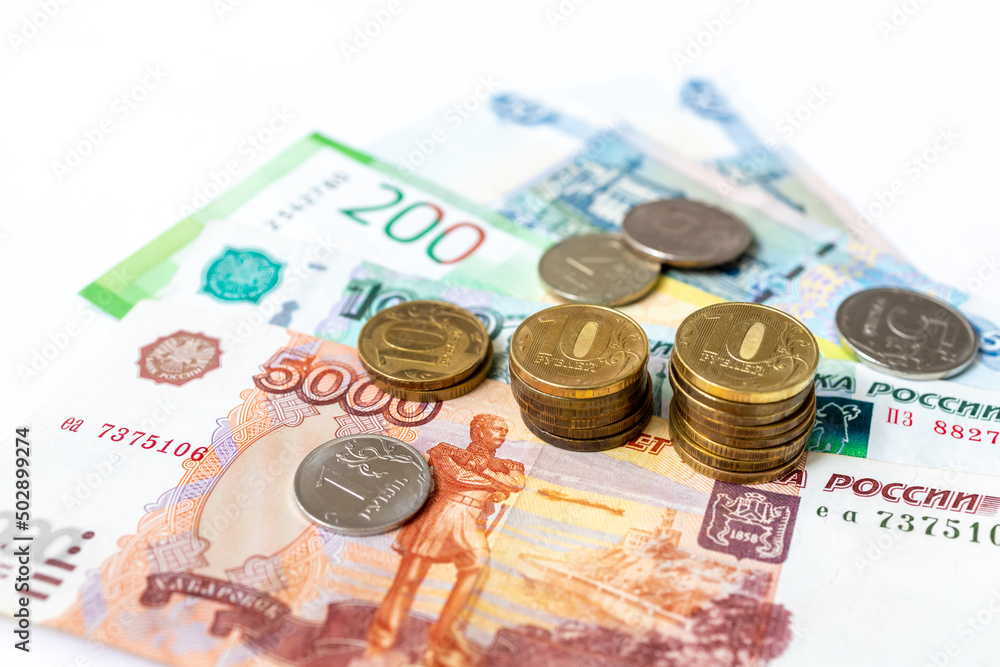 Russian rubles on a white background. Financial crisis, ruble devaluation concept. . Russian rubles on a white background. Financial crisis, ruble devaluation concept. .