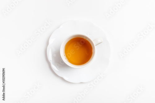Cup of green tea isolated in center of white background.