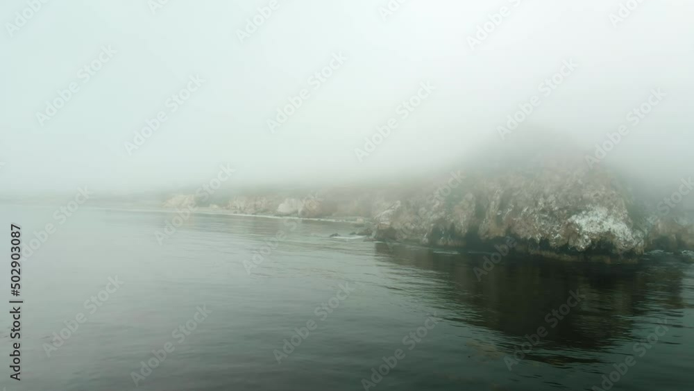 Epic Cliffs and Ocean Waves aerial view on a foggy day, California coastline Epic Cliffs and Ocean Waves aerial view on a foggy day, California coastline