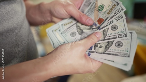 dollar money. bankrupt man counting money cash. business crisis finance dollar concept. close-up of a hand counting paper dollars. exchange finance economy usd dollar pay tax