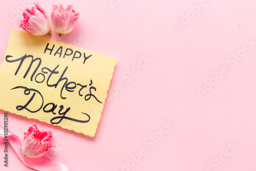 Fototapeta Naklejka Na Ścianę i Meble -  Happy Mothers day background with pink flowers, top view