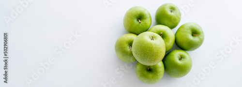 Wallpaper Mural top view of green and ripe apples on white, banner. Torontodigital.ca