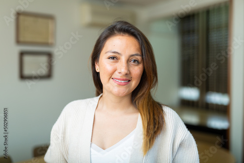 Portrait of positive female manager in modern office
