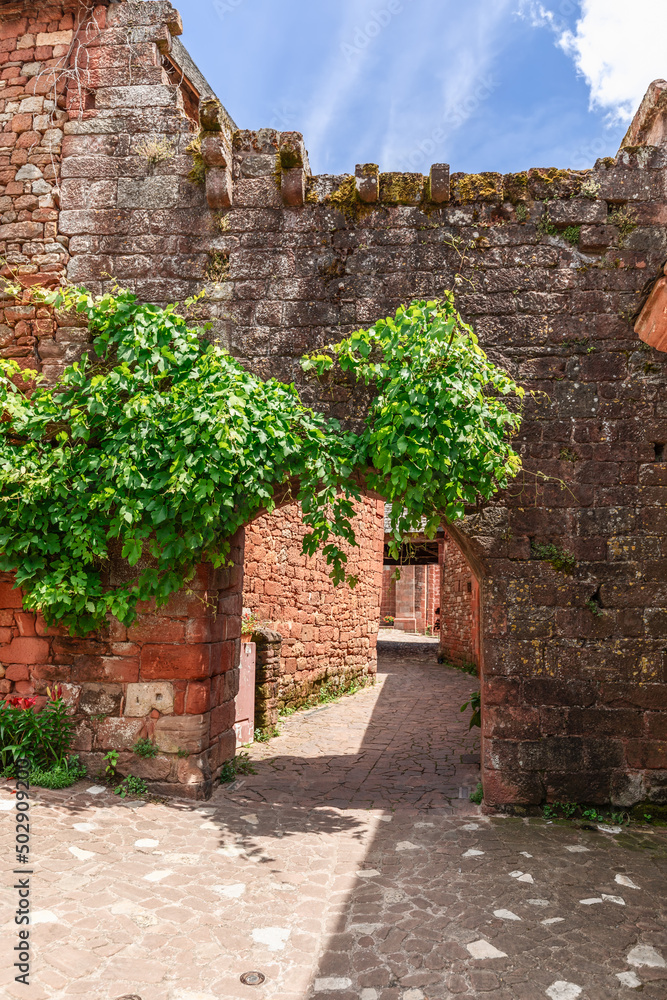 Cultural preservation includes the Porte Plate, named because it has no tower. It was the main entrance to the old priory of Collonges-la-Rouge, Correze department, New Aquitaine region, France